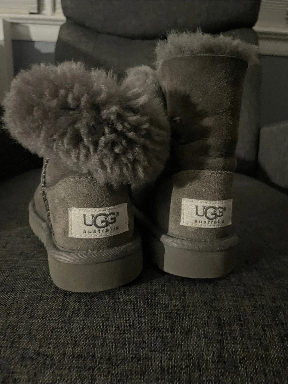 UGG Kids Short Shearling Boots in Gray with Pom Detail
